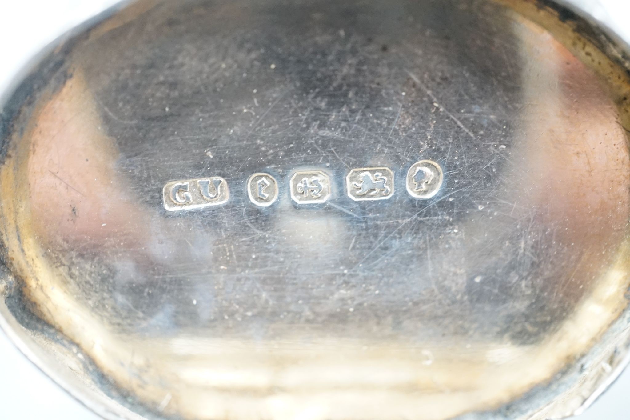 A Victorian engraved silver cusped oval vinaigrette, Hilliard & Thomasson, Birmingham, 1882, 39mm and a larger vinaigrette by George Unite, with engraved inscription.